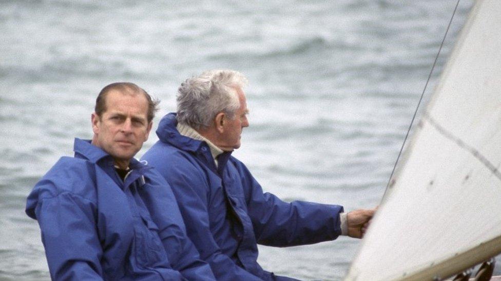 Prince Philip, Duke of Edinburgh, sailing at Cowes with Uffa Fox