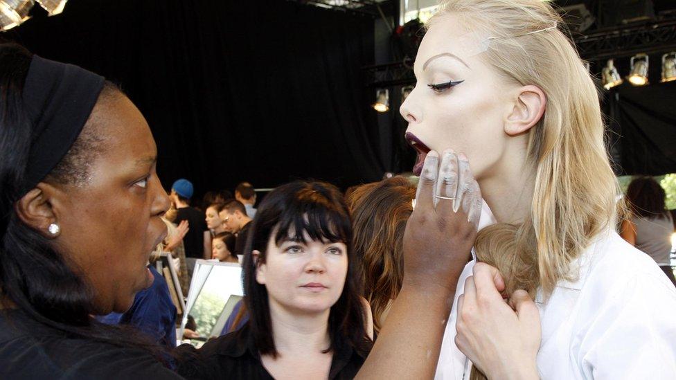 Make up artist Pat McGrath inspects a model's make up back stage for the Christian Dior Haute Couture Autumn Winter 2008 fashion show