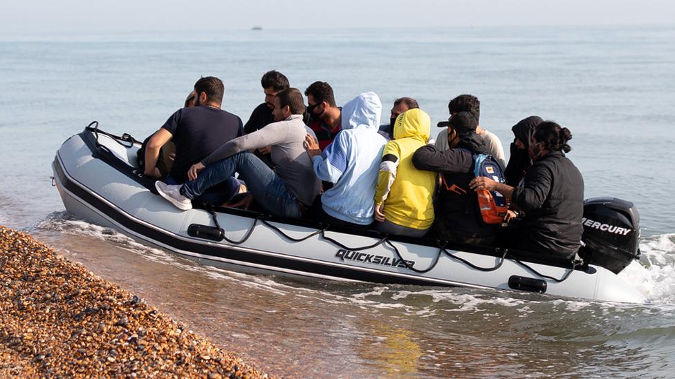 People arriving on a small boat