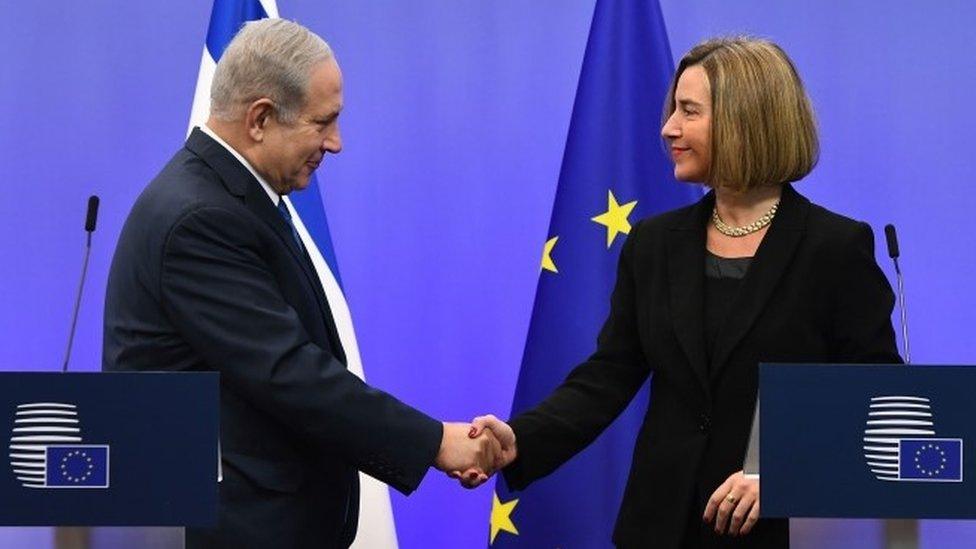 Benjamin Netanyahu shakes hands with EU foreign policy chief Federica Mogherini