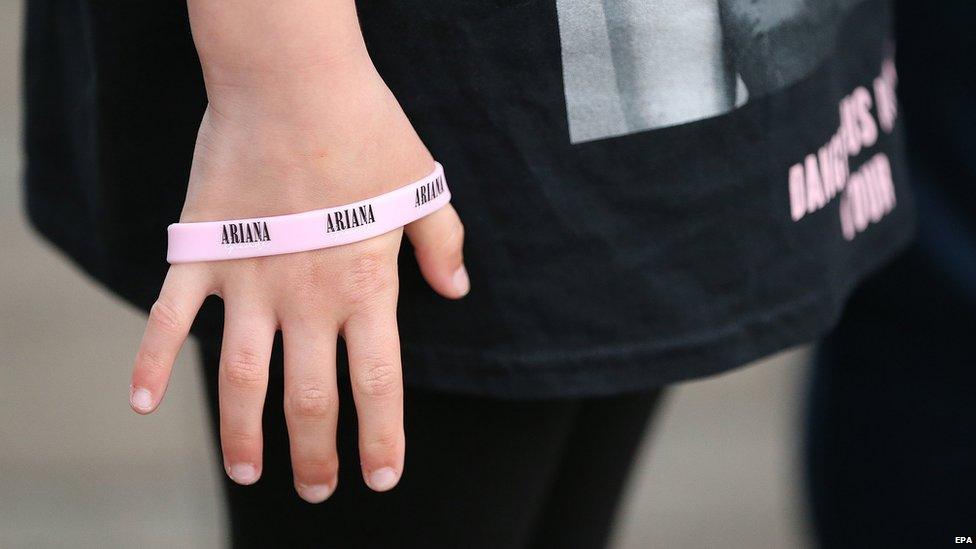 Child's hand with an Ariana bracelet on it