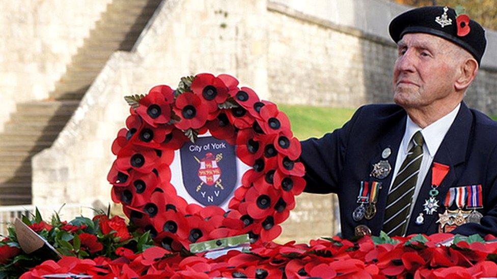 Veteran laying a wreath