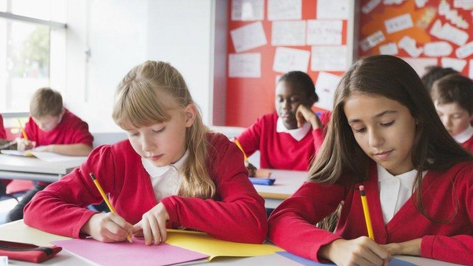 Children in class working at desk