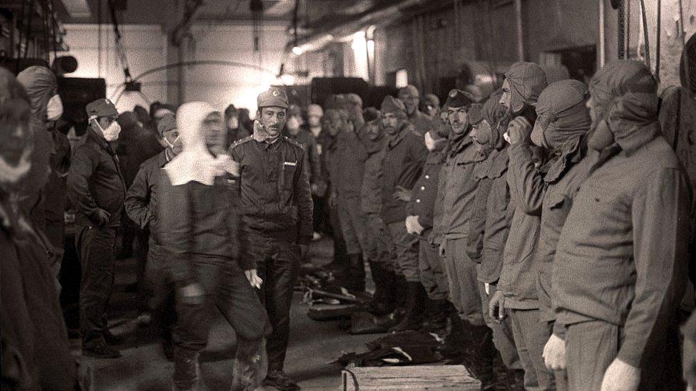 Firefighters pictured before going on the roof of reactor No. 4 to clean radioactive debris