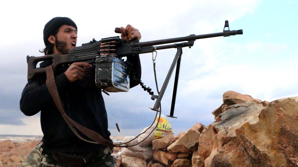A rebel fighter fires towards pro-regime forces during clashes in Sheikh Najar area of the restive Syrian city of Aleppo on February 25, 2014