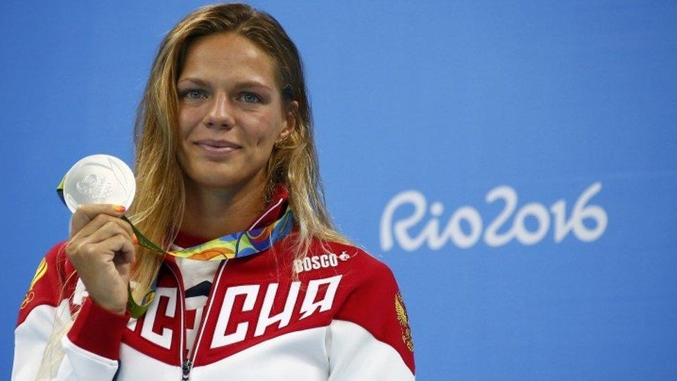 Russia's Yulia Efimova poses with her silver medal at the Rio Olympics.