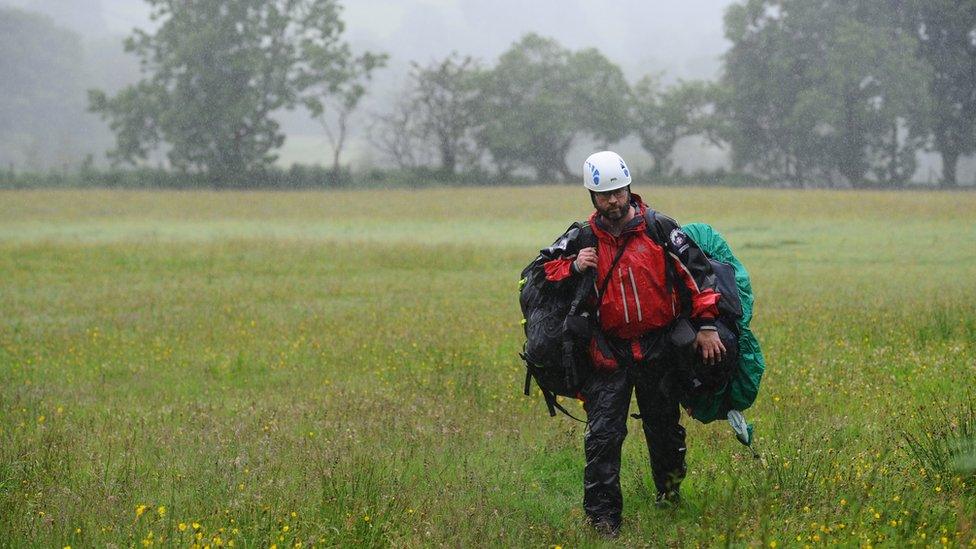 A rescuer involved in the search