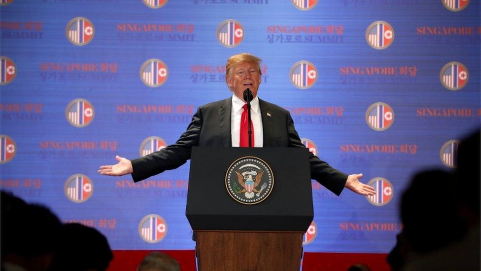 Photo of Donald Trump at a podium in Singapore