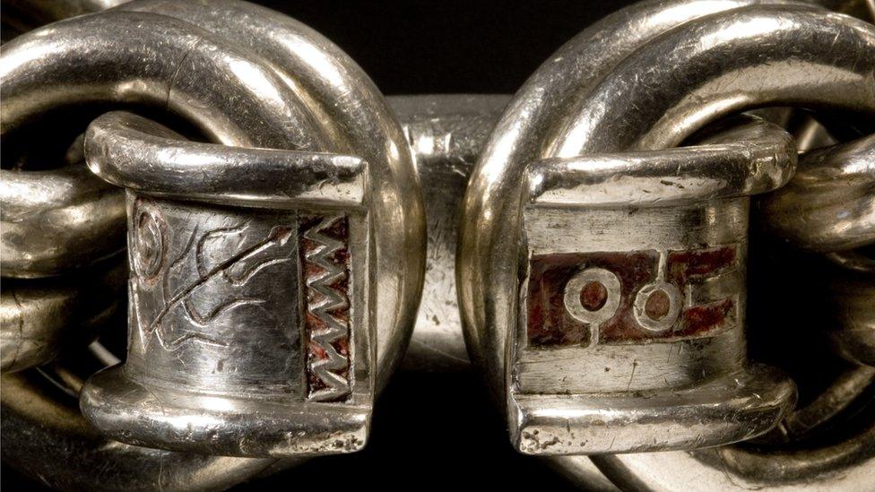 Pictish chain of 22 double links with ring engraved with designs inlaid with red enamel, from Whitecleugh, Lanarkshire, 6th or 7th century.jpeg