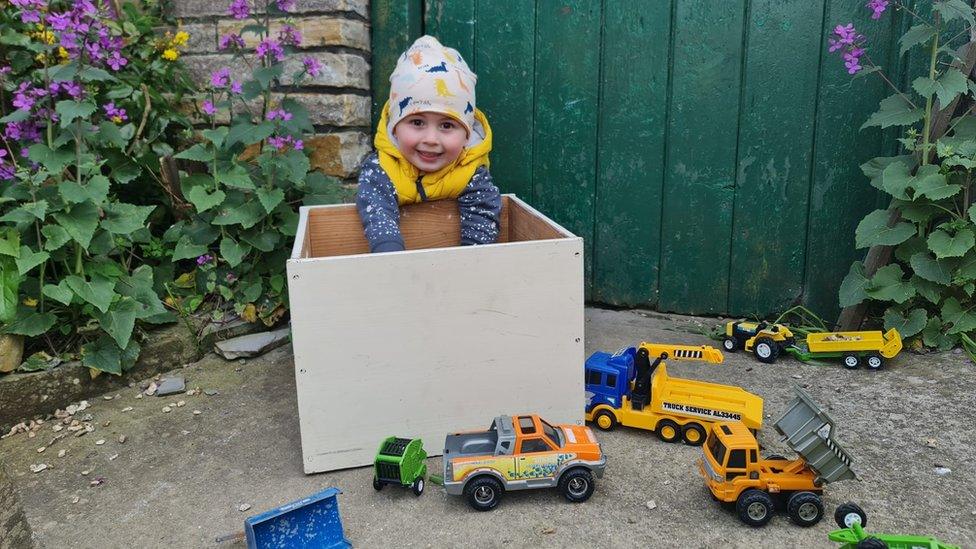 Egor playing with toys