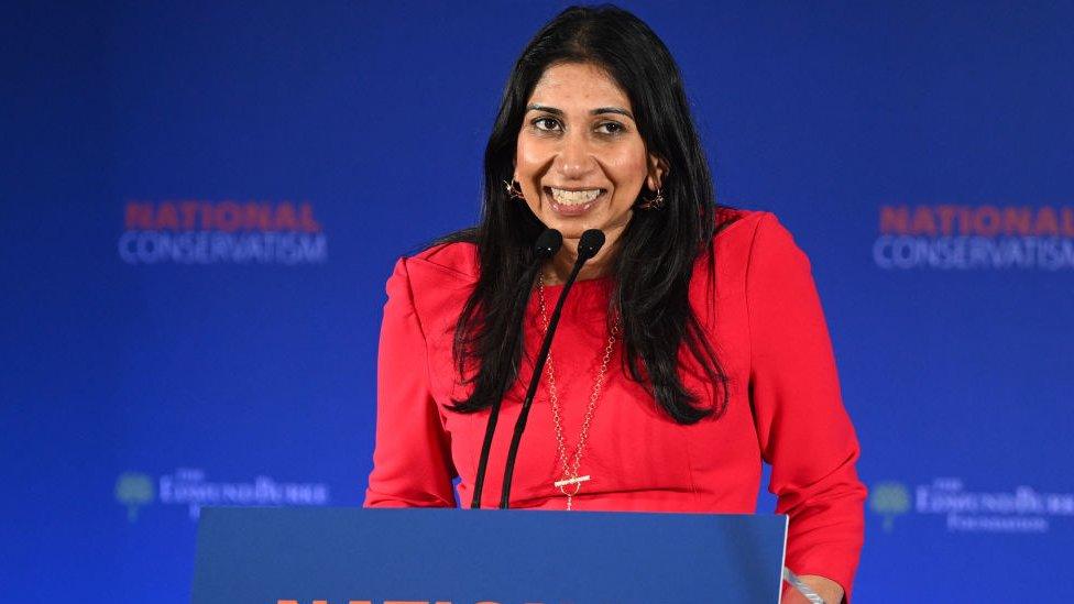 Suella Braverman speaks at the podium of the National Conservatism conference