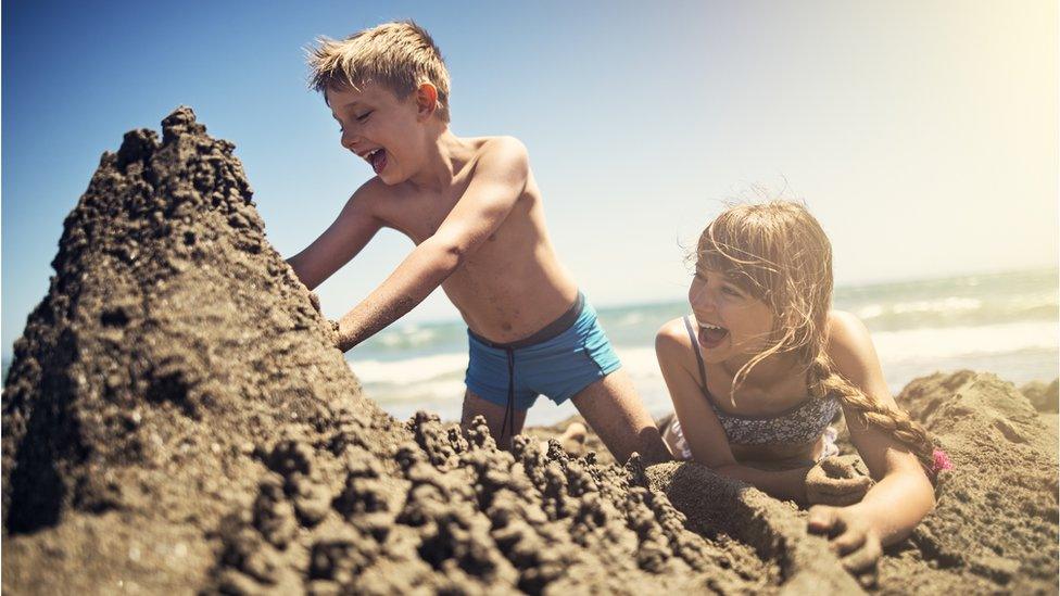 Brother and sister on beach