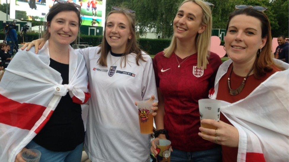 England fans draped in flags in Battersea Park