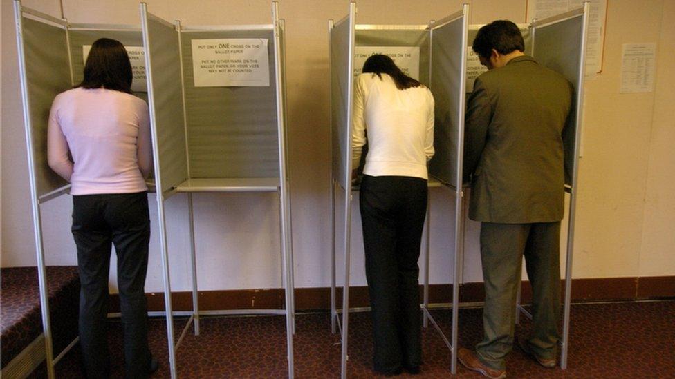 Voters in polling booths