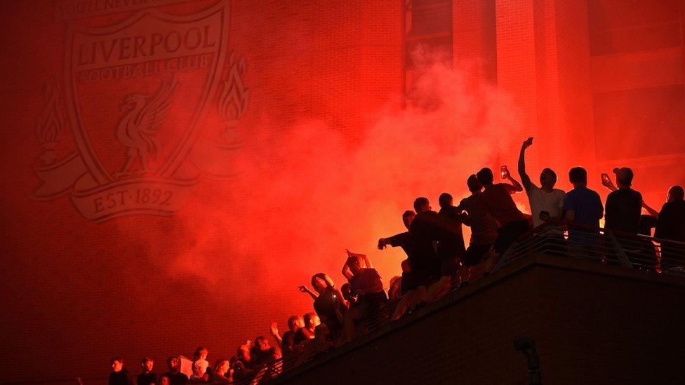 Liverpool fans celebrate outside Anfield