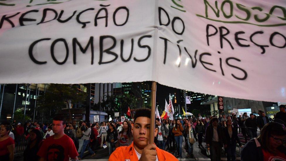 Demonstrators protest against high fuel and cooking gas costs in front of Petrobras oil company headquarters in Sao Paulo, Brazil on 30 May 2018.