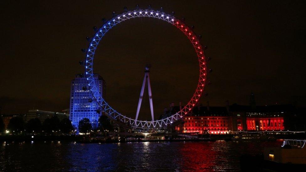 The London Eye illuminated in the colours of the French flag