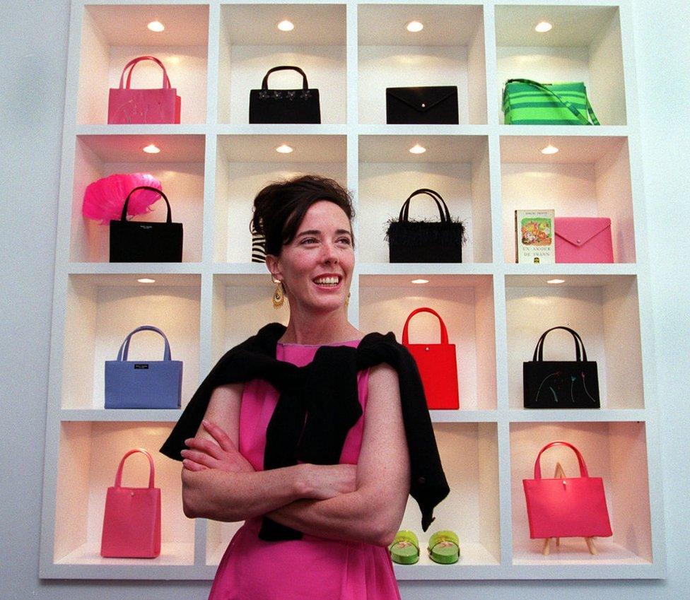 The fashion designer photographed amongst her handbags in 1999