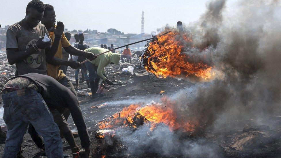 Men burning electronic waste in at the Agbogbloshi electronic waste site in Accra, Ghana - Monday 27 August 2018