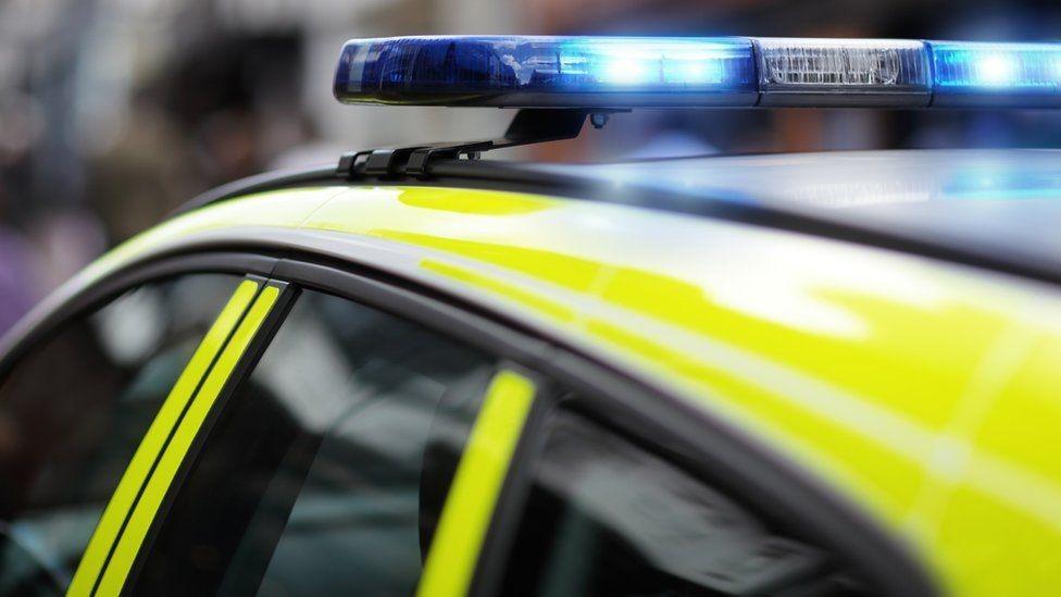 Police car roof with blue light