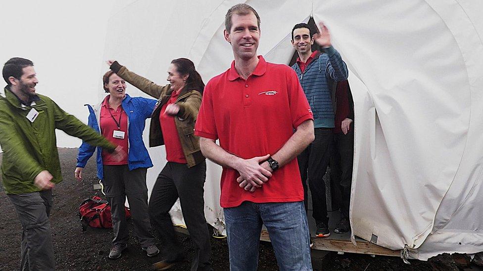 In this photo provided by the University of Hawaii, six scientists walk out of their Mars simulation habitat on slopes of Mauna Loa on the Big Island, Hawaii, Sunday 28 August, 2016.