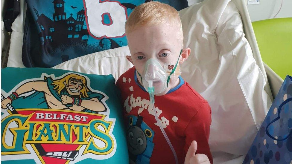 Blake in hospital with his Belfast Giants memorabilia