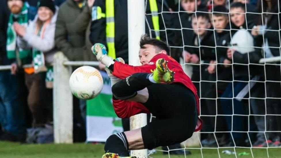 Goalkeeper Martin Conway saving a penalty