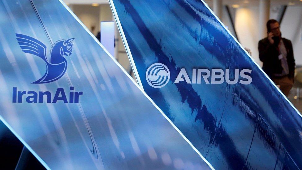 The logos of Airbus group and IranAir are pictured as IranAir takes delivery of first new Western jet, an Airbus A321, under an international sanctions deal in Colomiers, France, January 11, 2017