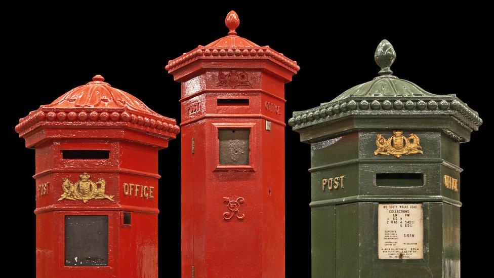 Two red and one green Penfold post box