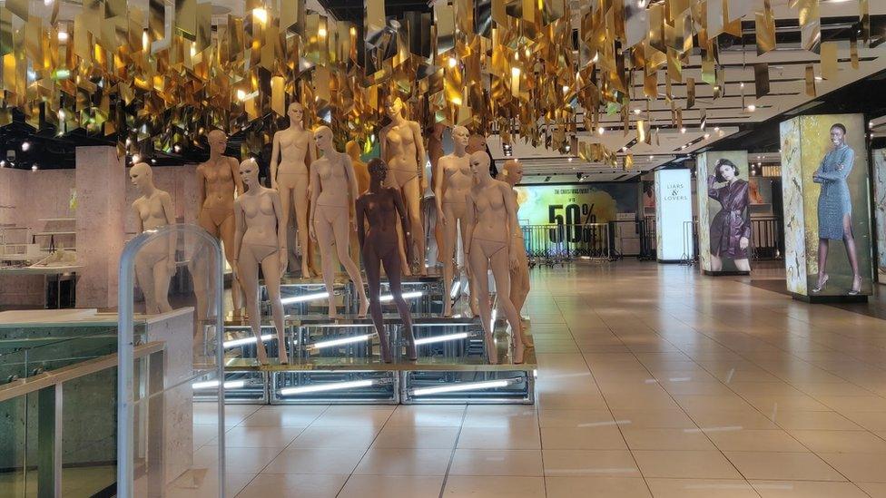 Mannequins inside a deserted Topshop store on Oxford Street