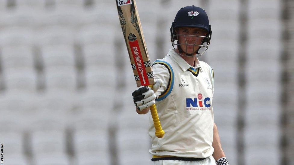 Harry Brook raises his bat