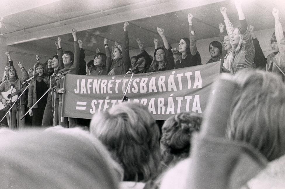 Women carry banner on women's "day off"