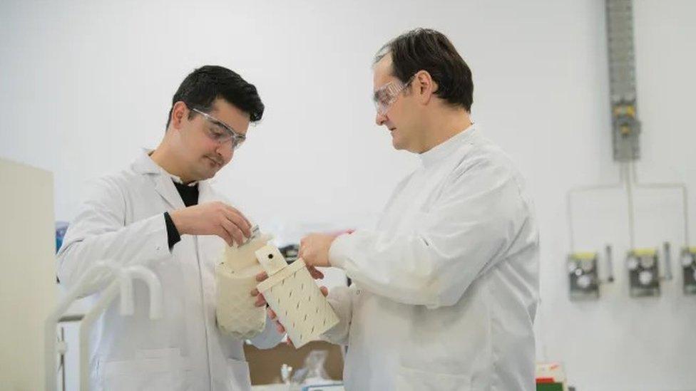 Design Engineer Saqib Ali, left, and Dr Sterghios Moschos look at a prototype of the breath collecting device