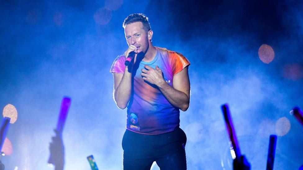 chris martin from coldplay performing