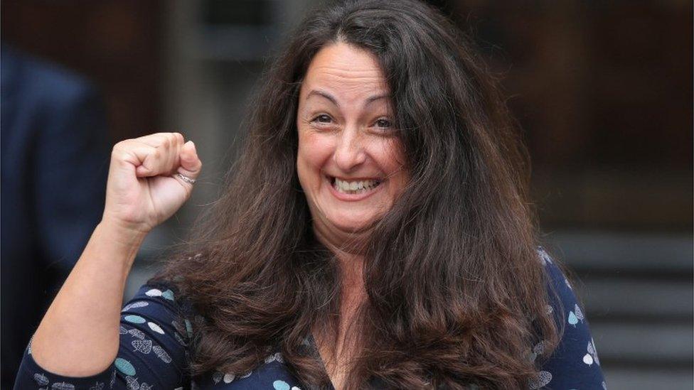 Samantha Jefferies punches the air and smiles after leaving the High Court