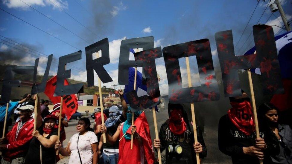 Demonstrators form the words "JOH Out" during a protest against Honduras" President Juan Orlando Hernandez and his government in Tegucigalpa, Honduras, January 27, 2019.