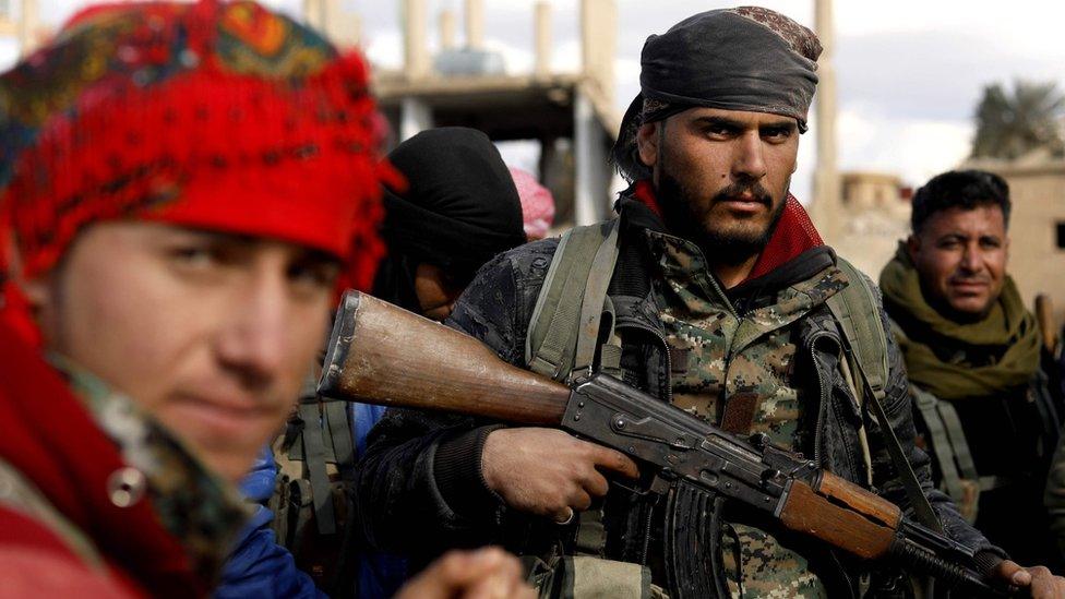 Fighters from the US-backed Syrian Democratic Forces (SDF) alliance in Baghuz, Syria (19 February 2019)