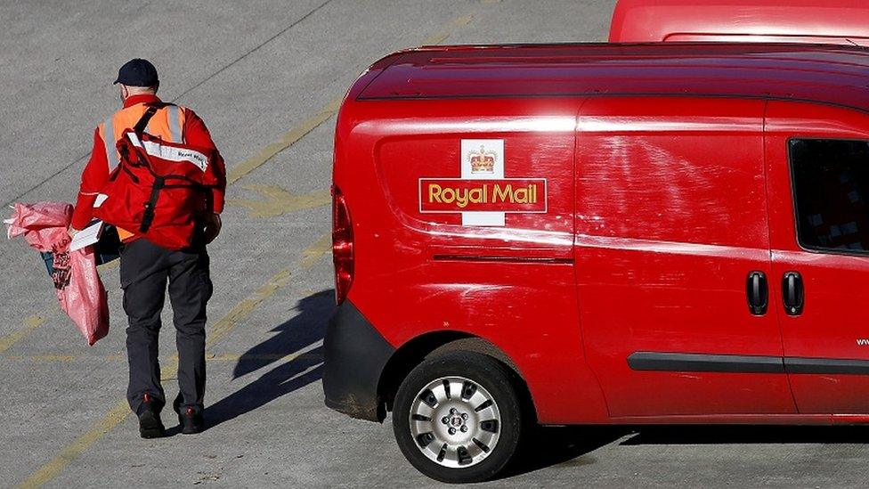 Royal Mail worker and van