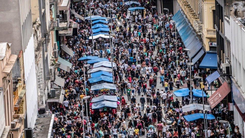 Customers in busy street making purchases in Sao Paulo, Brazil, on December 2, 2018