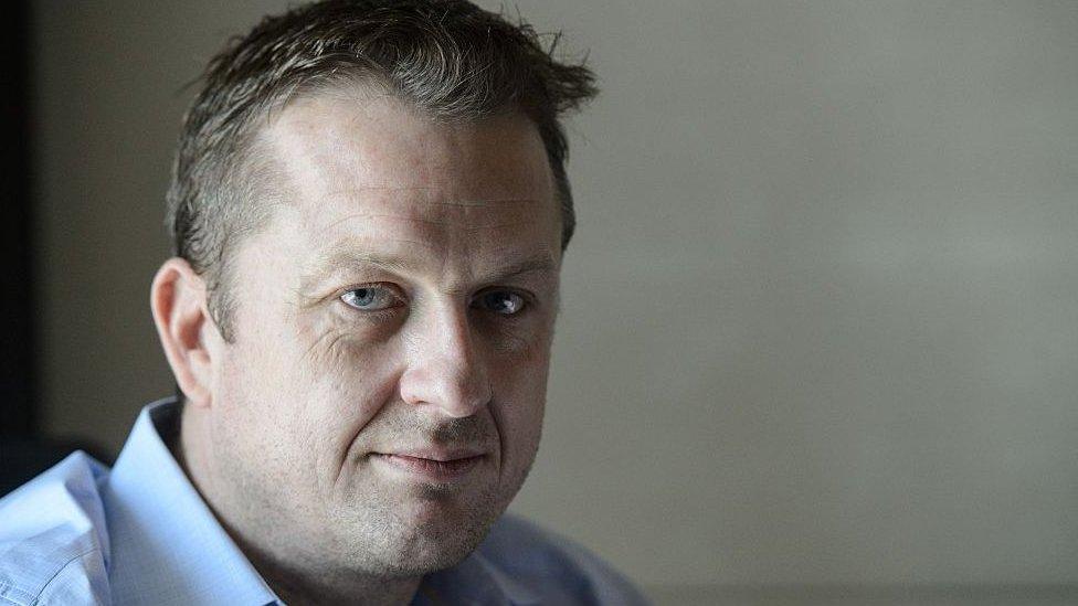 Journalist Andrew MacGregor Marshall poses during an interview with AFP at a hotel room in Hong Kong on 22 July 2016