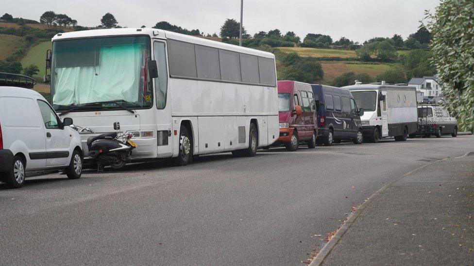 Vehicles parked on a road in Falmouth