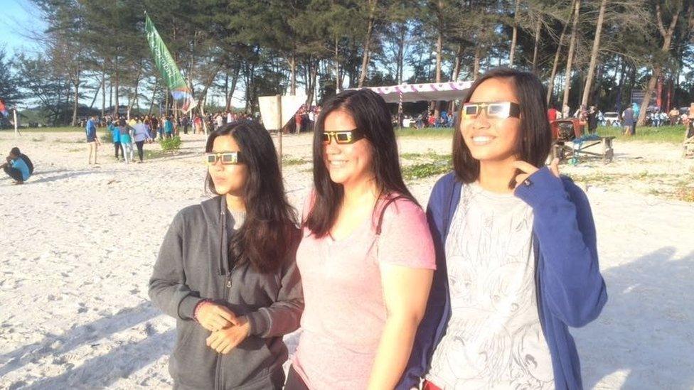 Women on a beach in goggles