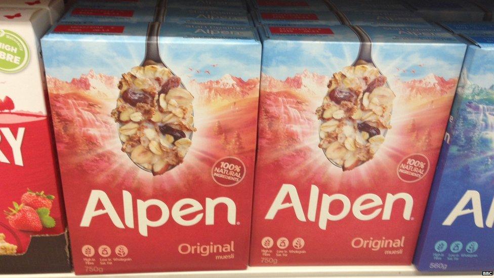 Alpen cereal on supermarket shelf.