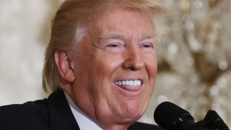 Donald Trump sticks his tongue out during his press conference.