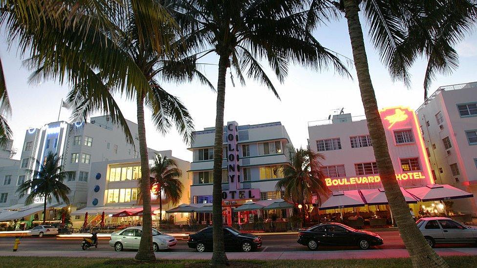 Renovated hotel buildings overlooking Ocean Drive are adorned by neon lights in the early evening 26 September 2006.