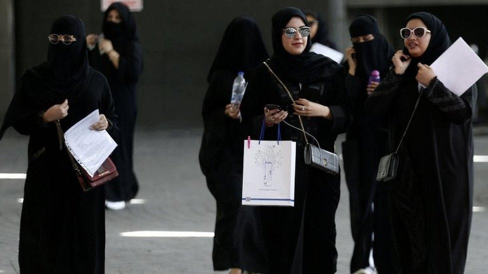 Women walk among traffic in Riyadh (file photo)