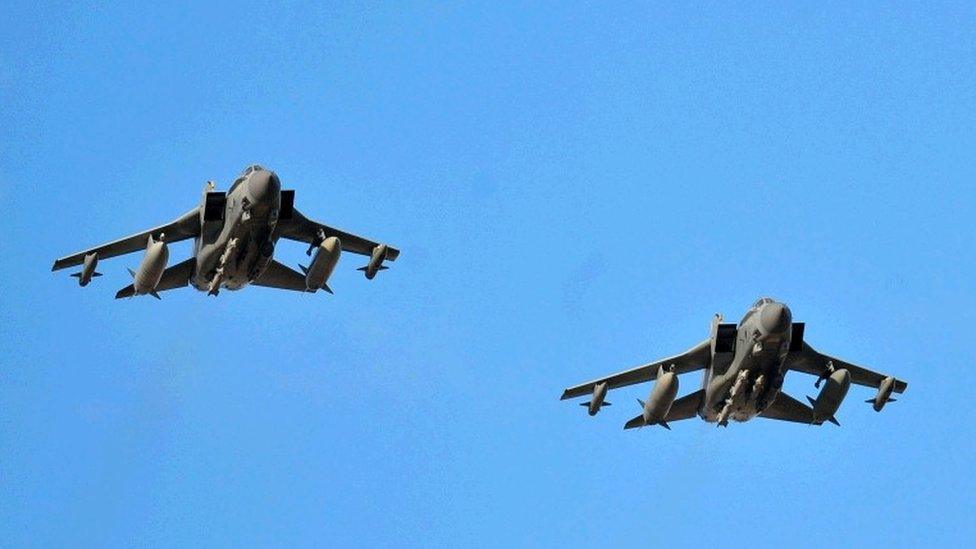 Two RAF Tornado GR4"s, both with remaining weapons ordnance, approach RAF Akrotiri in Cyprus, as they return to the base after carrying out some of the first British bombing runs over Syria.