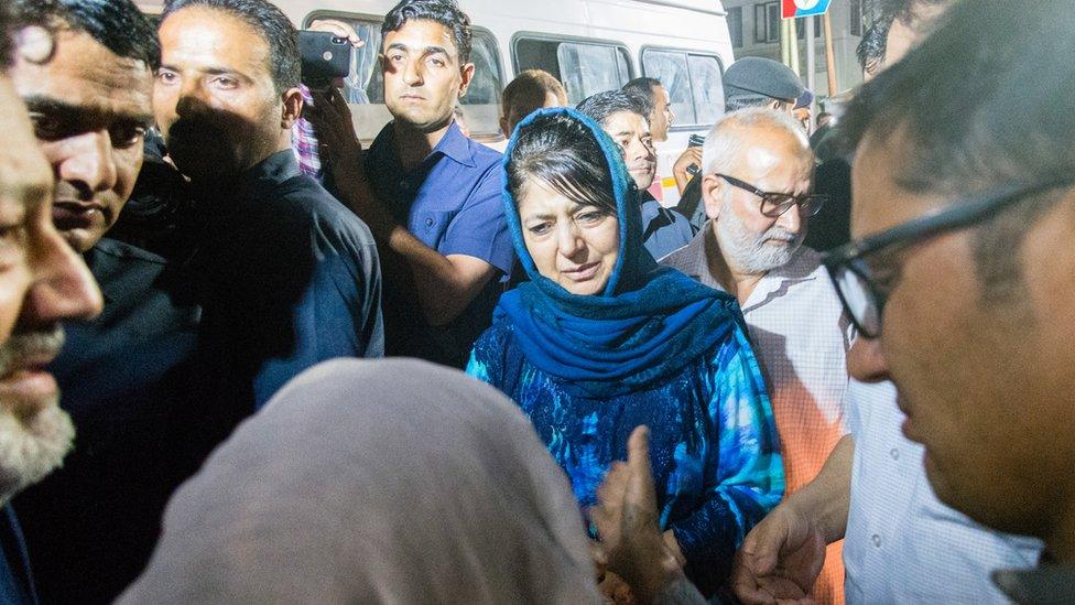 Mehbooba Mufti Chief Minister of Jammu and Kashmir consoles the mother of Syed Shujaat Bukhari, the editor of Rising Kashmir daily newspaper