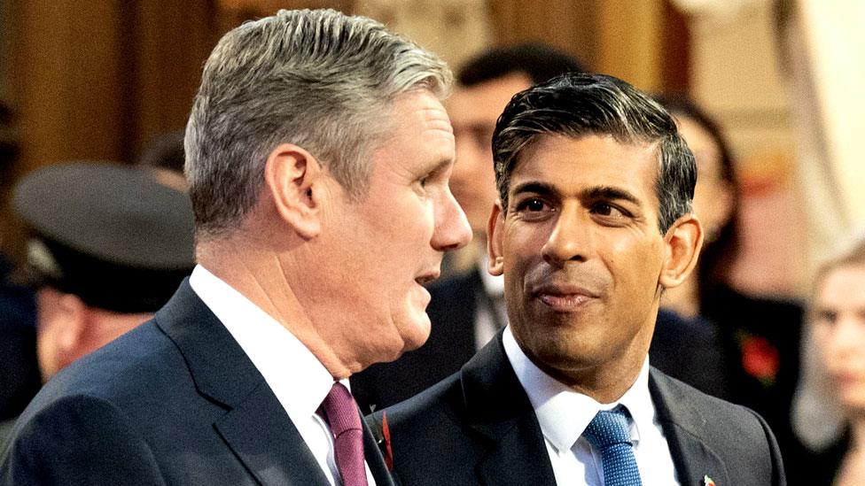 Prime minister Rishi Sunak walks with Labour Party leader Sir Keir Starmer through the Central Lobby at the Palace of Westminster following the State Opening of Parliament in the House of Lords, London on 7 November 2023