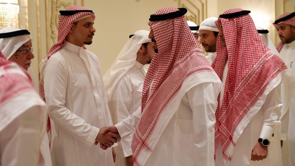 Salah Khashoggi (second left), the son of murdered Saudi journalist Jamal Khashoggi, receives mourners at an events hall in the Saudi coastal city of Jeddah, 16 November 2018